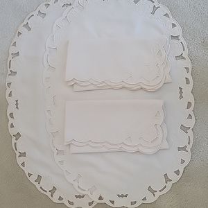 Vintage cloth placemats with matching cloth napkins.